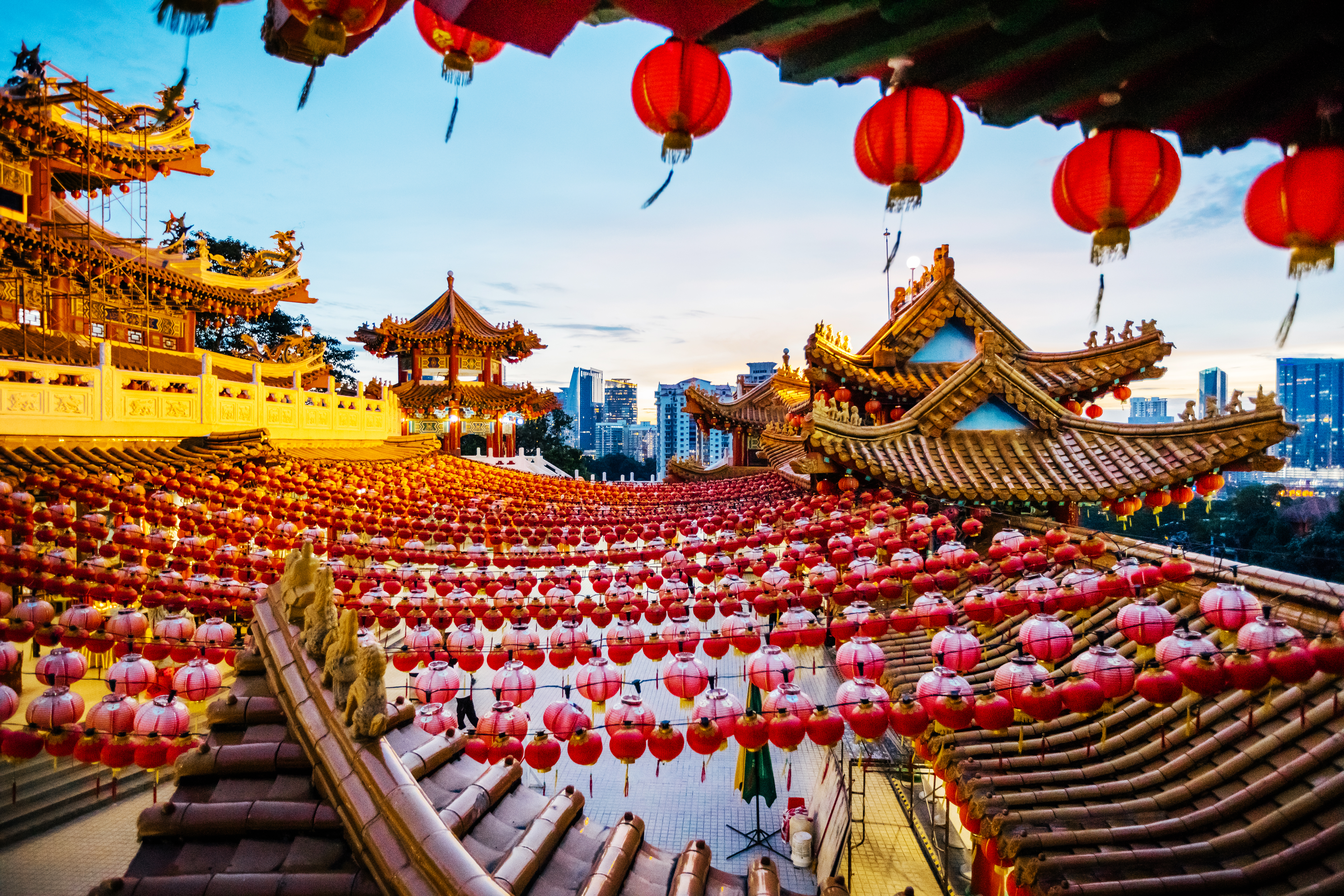a large asian building with red lanterns