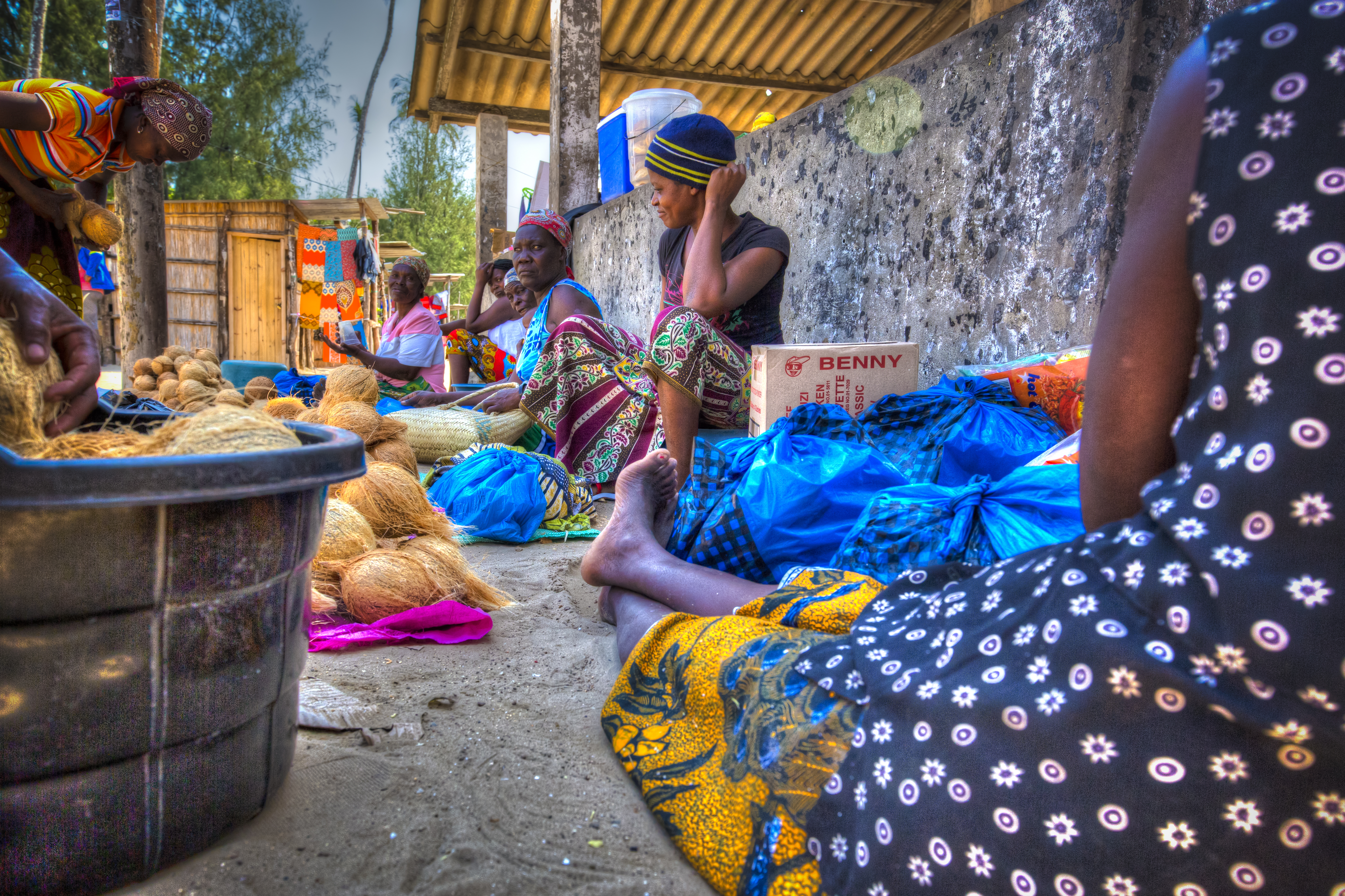a group of women sitting on the ground