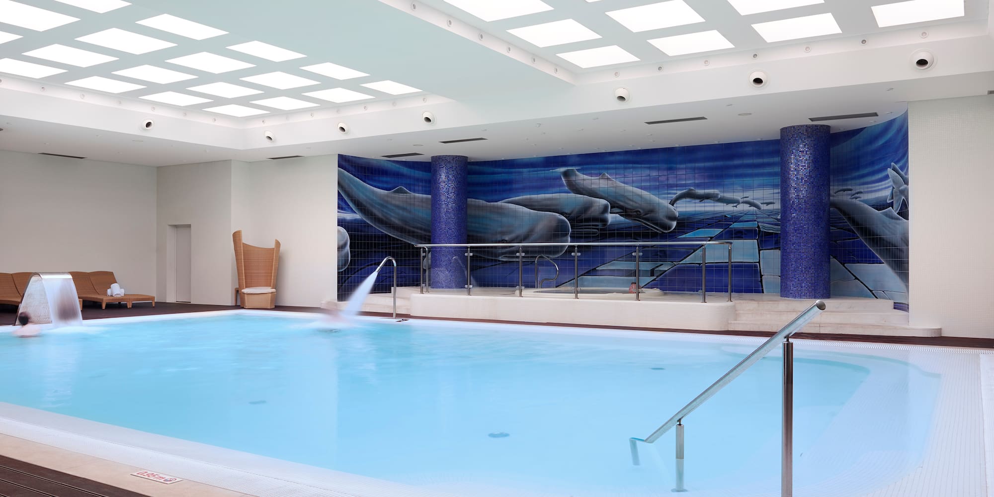 a swimming pool with a wall of lights.