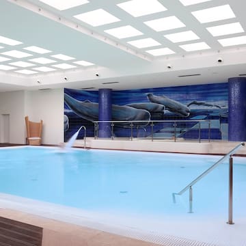 a swimming pool with a wall of lights.