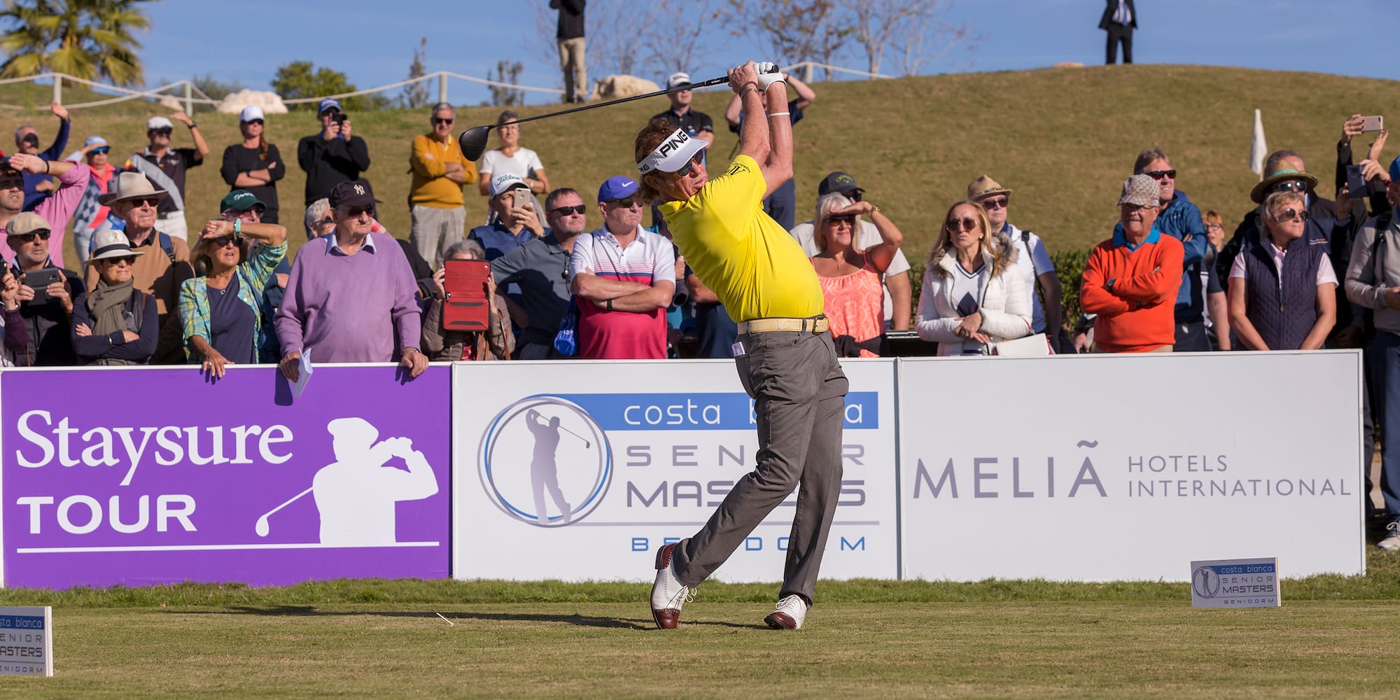 a man swinging a golf club