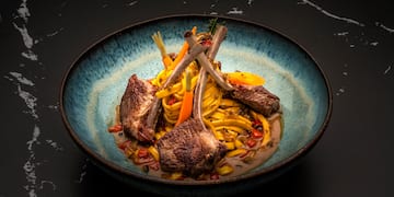 a bowl of food on a black surface