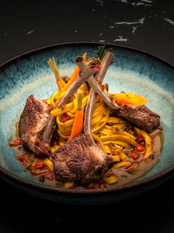 a bowl of food on a black surface