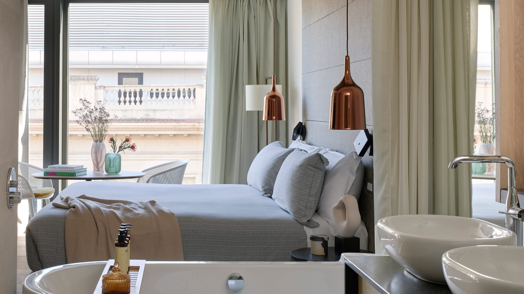 a bedroom with a bed and sink