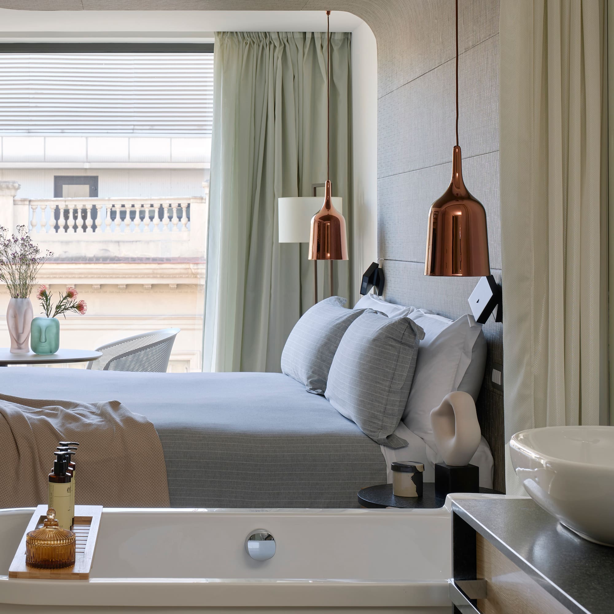 a bedroom with a bed and sink