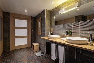 a bathroom with two sinks and a mirror