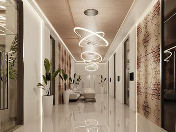 a hallway with white walls and white flooring