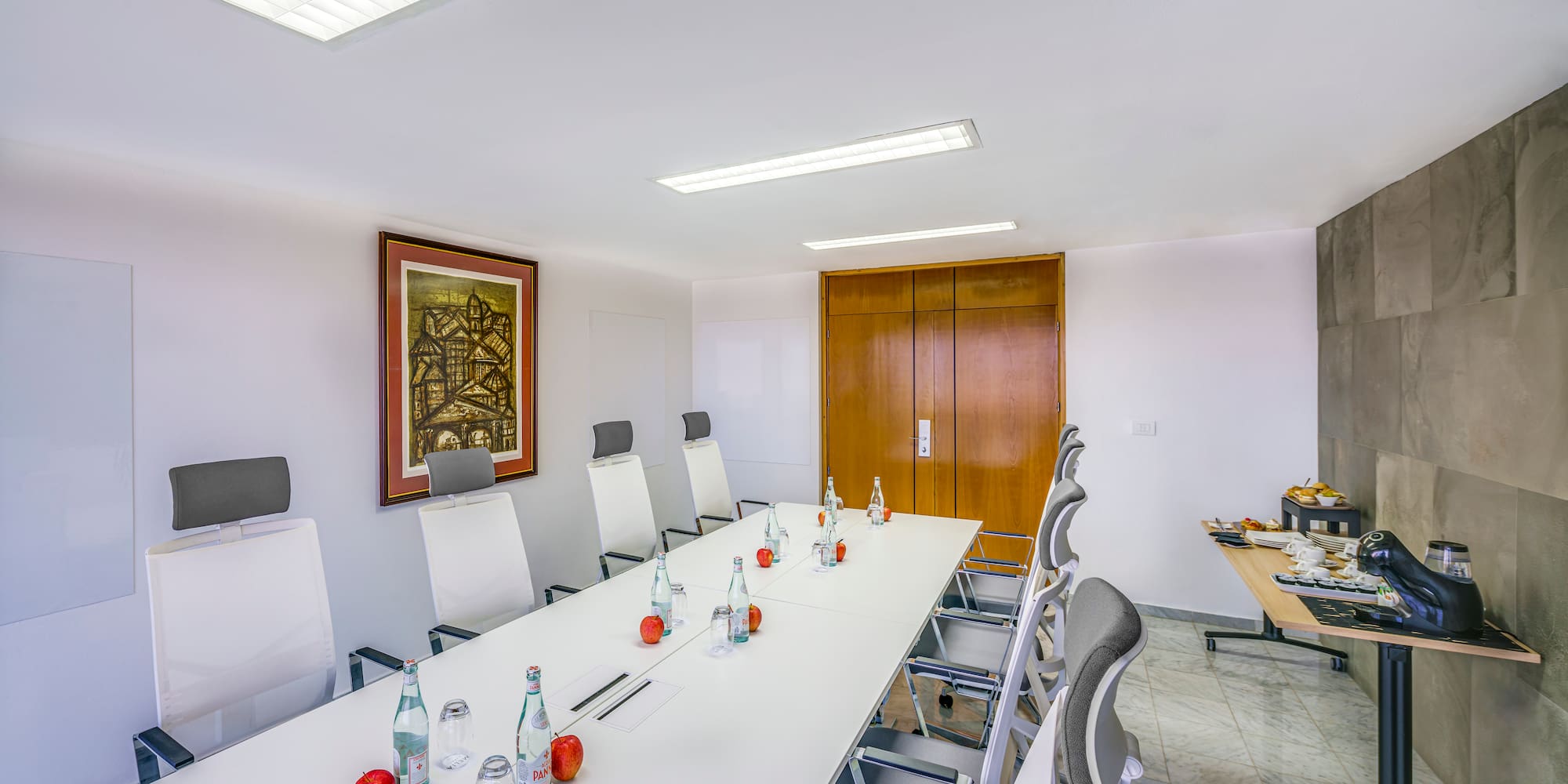 a conference room with a table and chairs