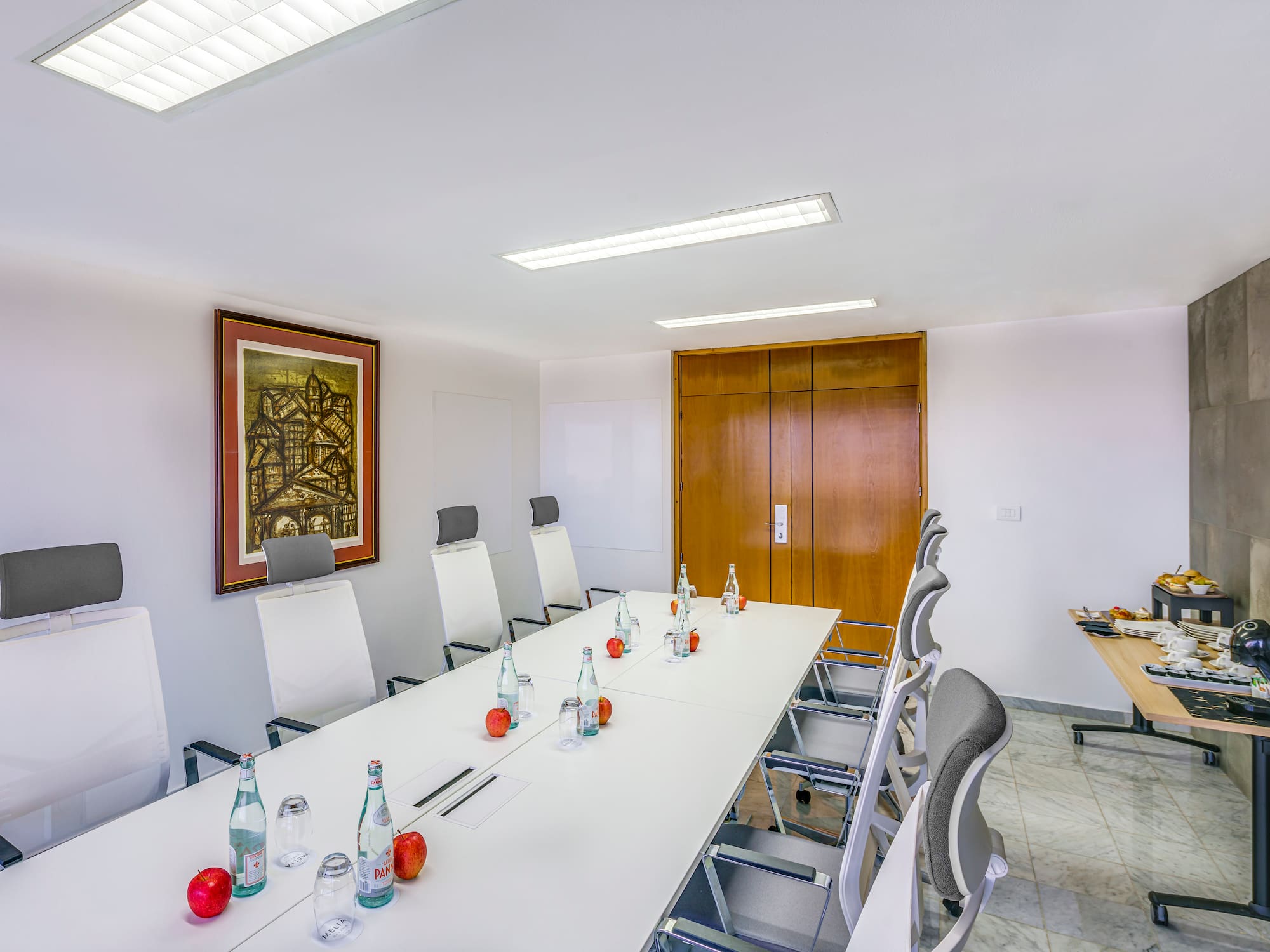 a conference room with a table and chairs