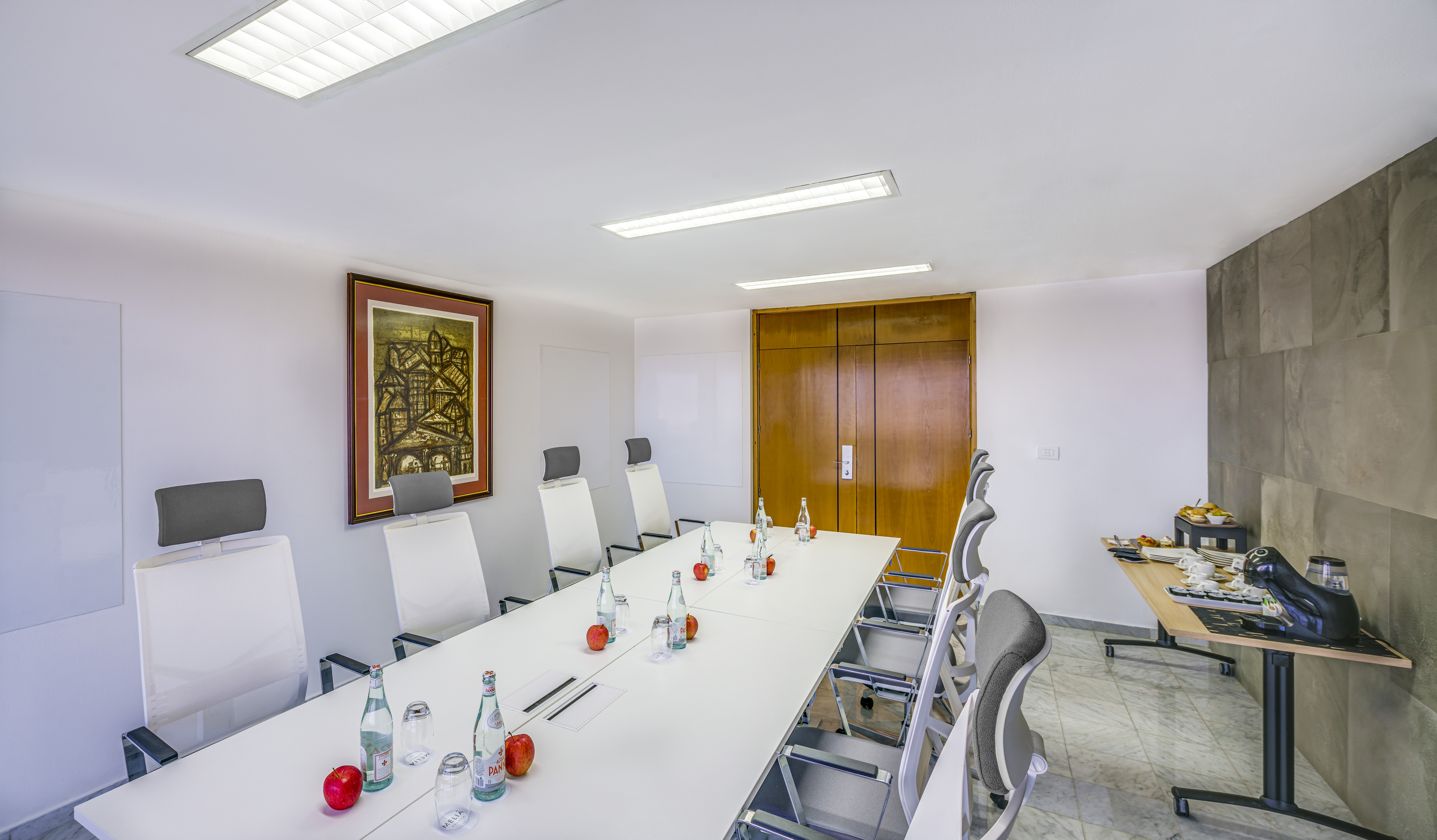 a conference room with a table and chairs