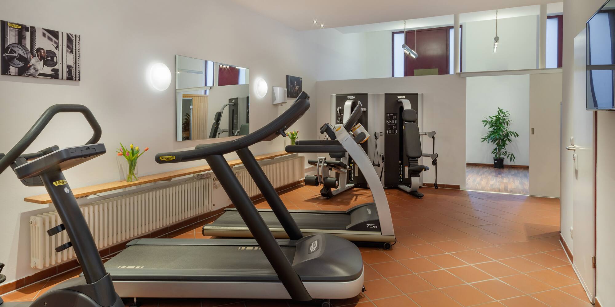 a room with treadmills and exercise equipment