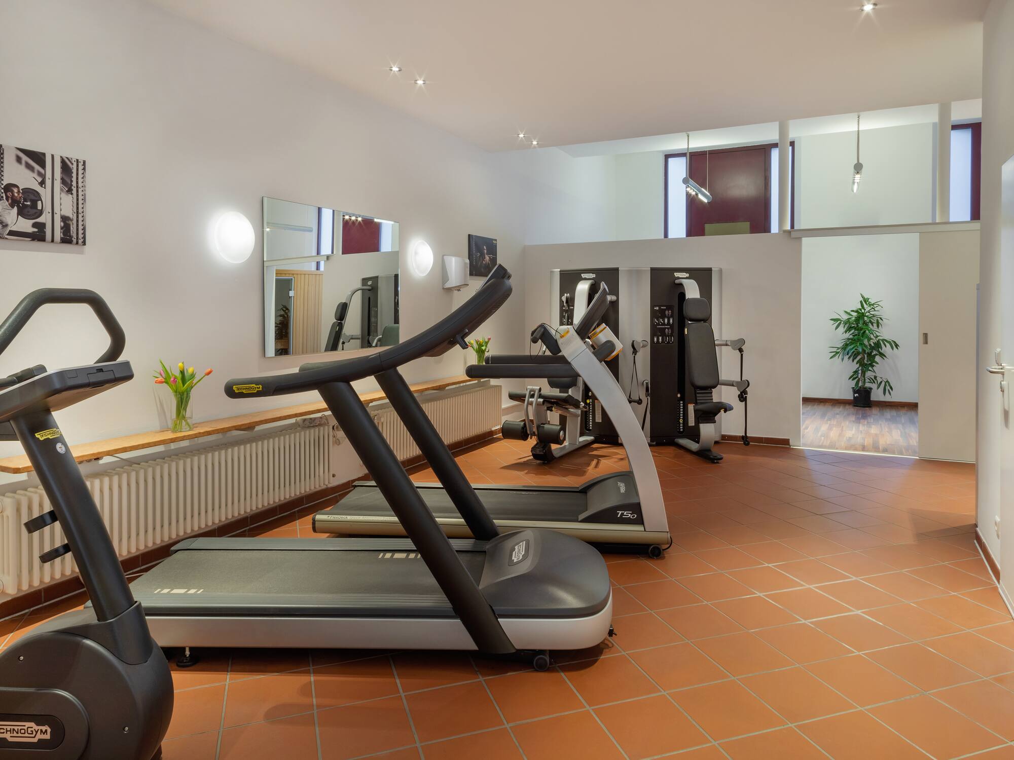 a room with treadmills and exercise equipment