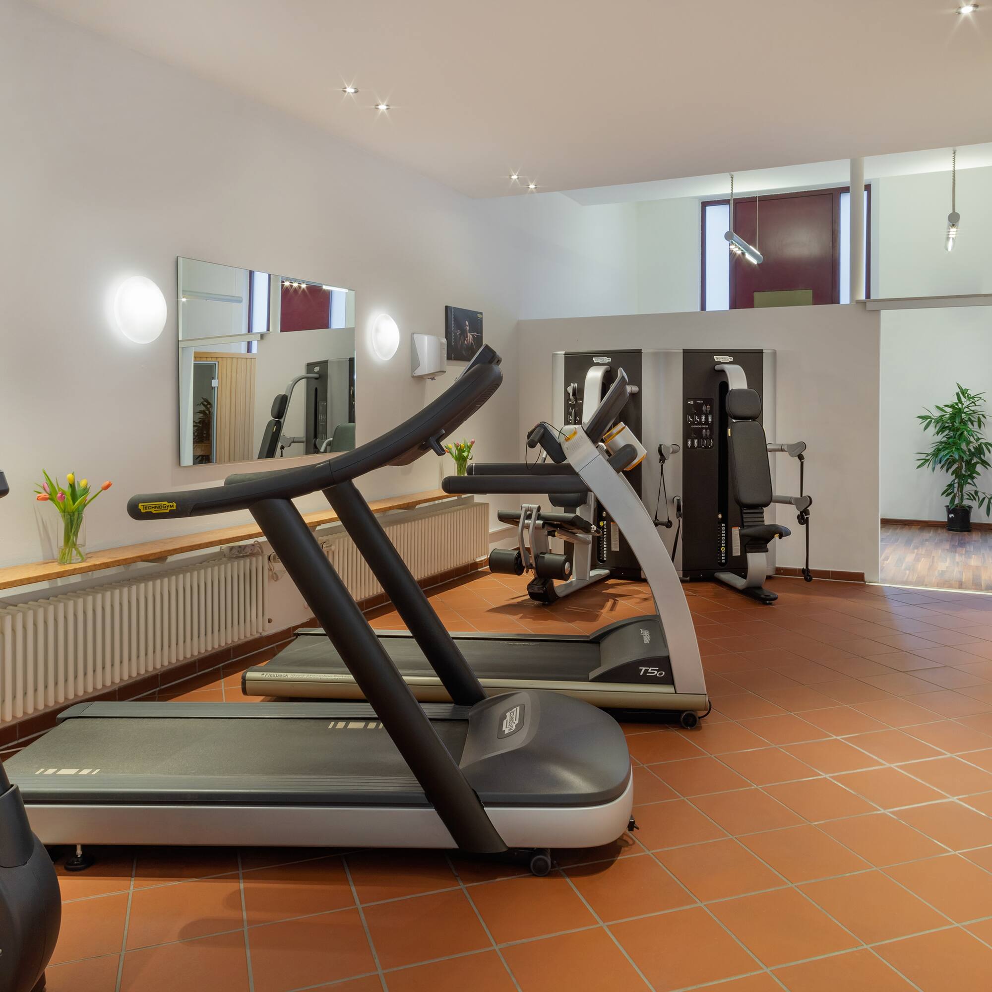 a room with treadmills and exercise equipment