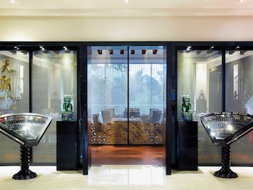 a glass doors with a group of statues