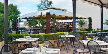 a restaurant with tables and chairs
