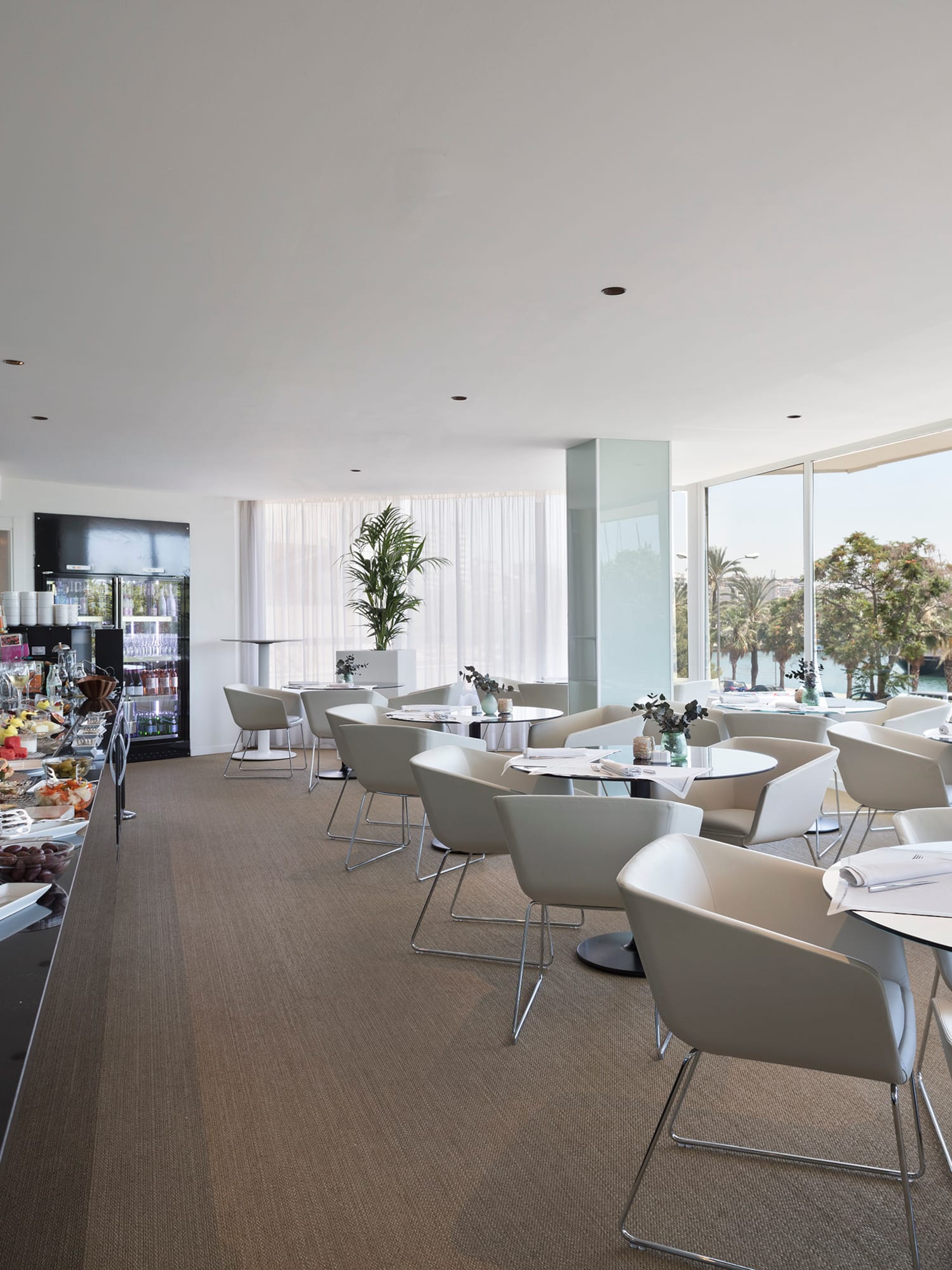 a room with tables and chairs and food on it