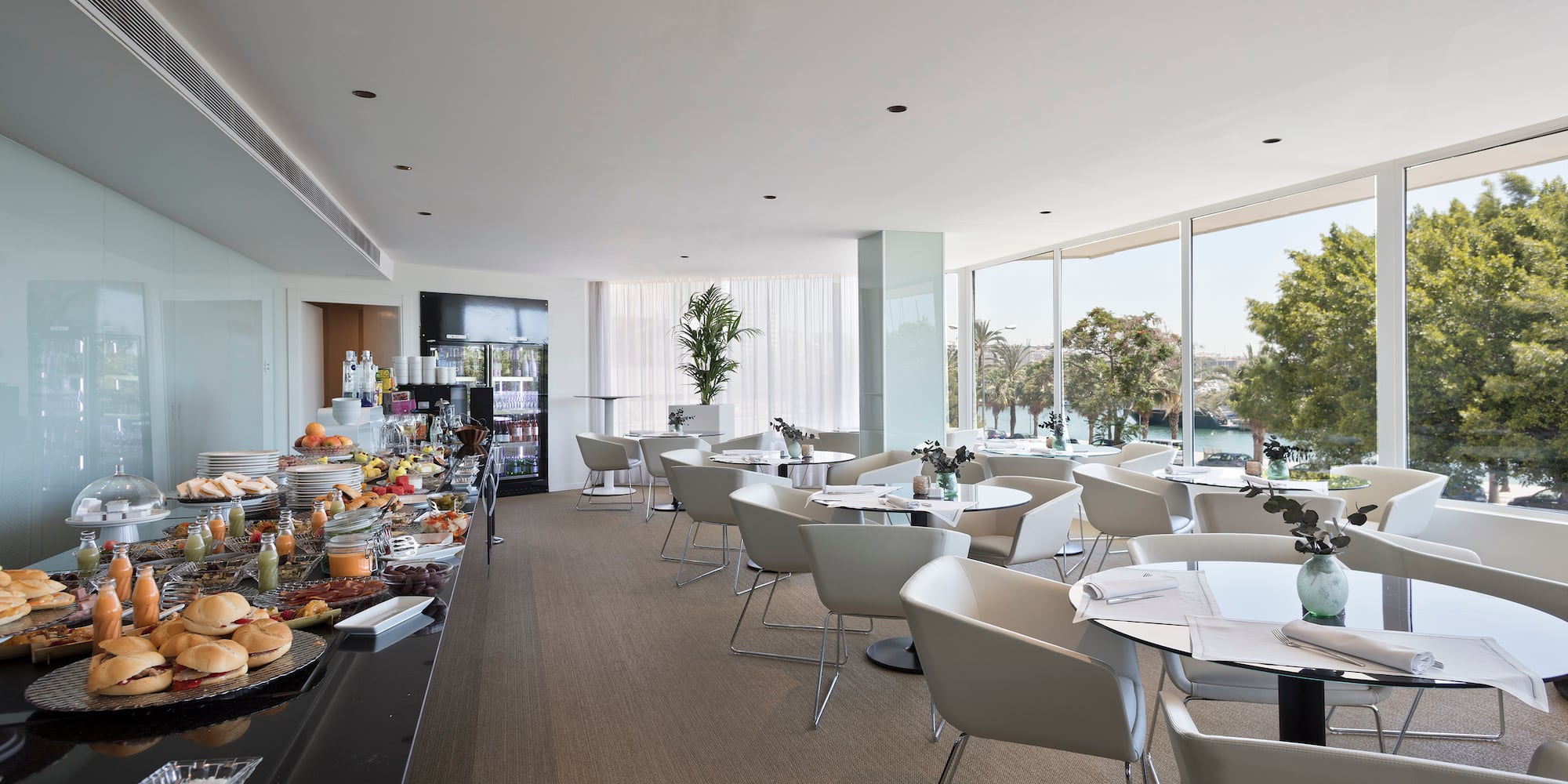 a room with tables and chairs and food on it