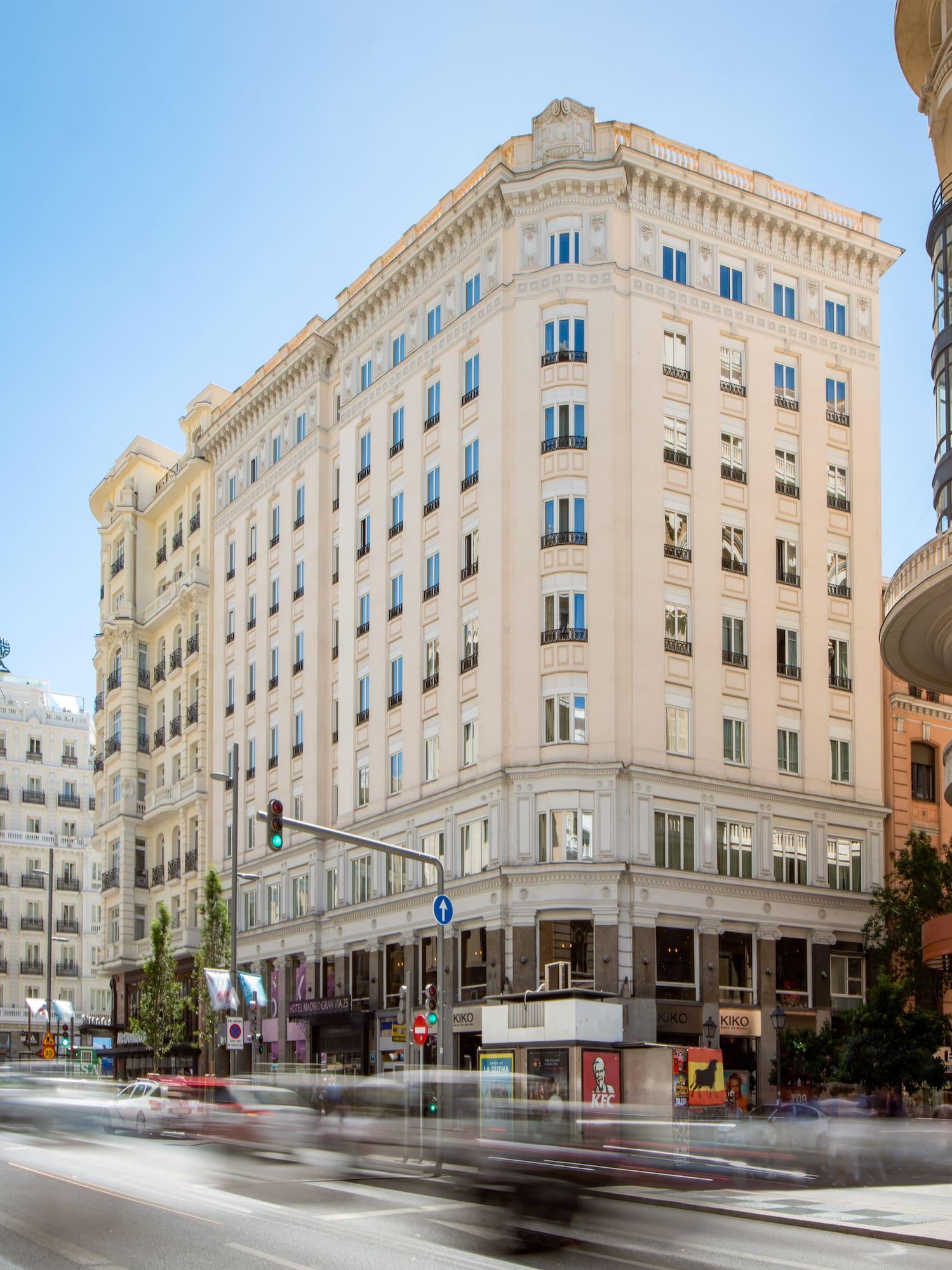 a street with cars and buildings