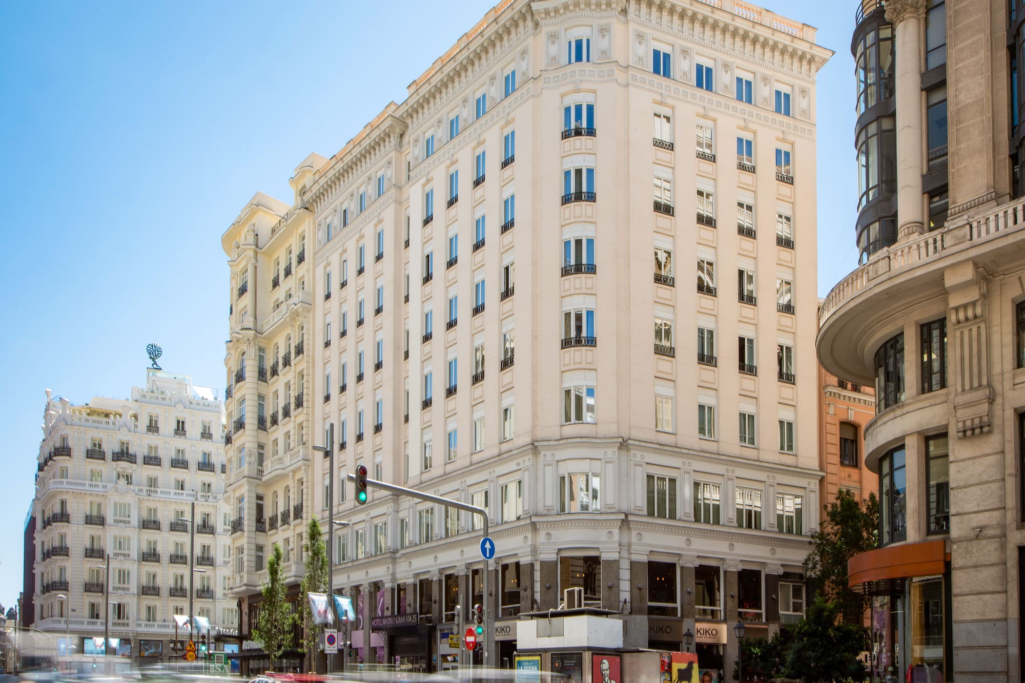 a street with cars and buildings