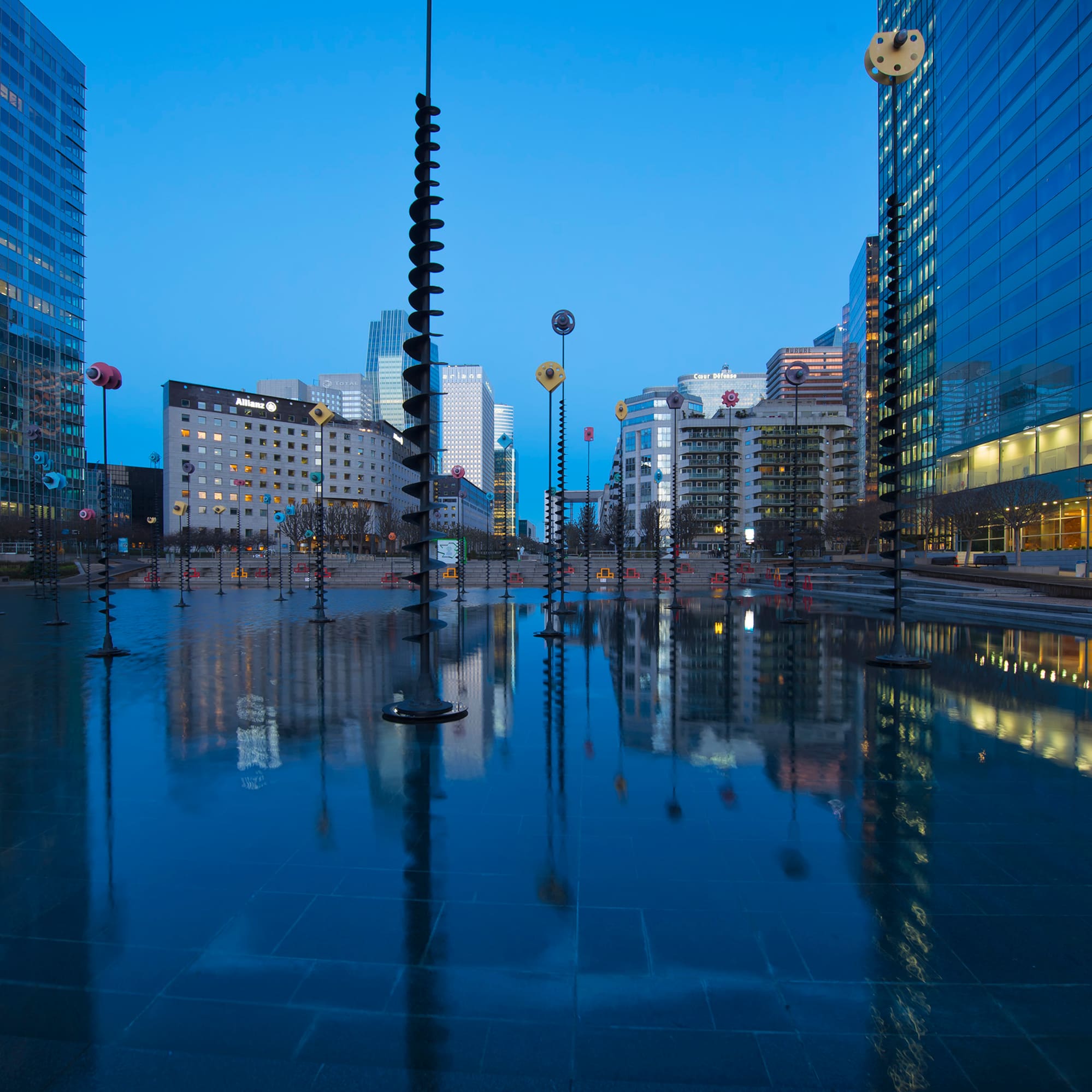 a city with tall buildings and a pool of water