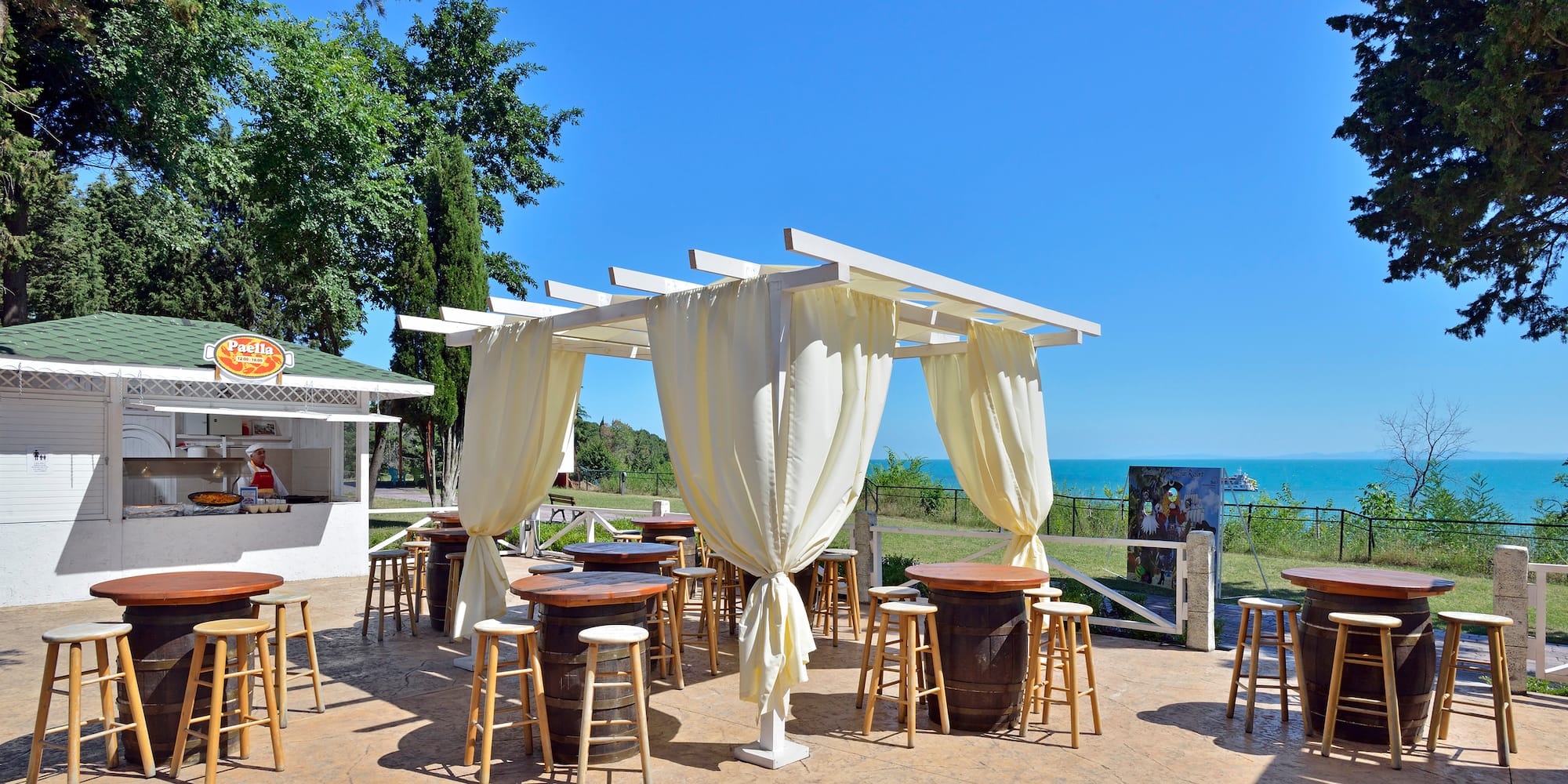a patio with tables and chairs