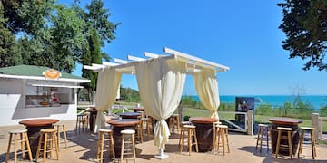 a patio with tables and chairs