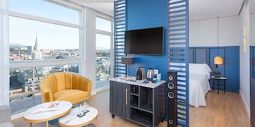 a room with a tv and a blue wall