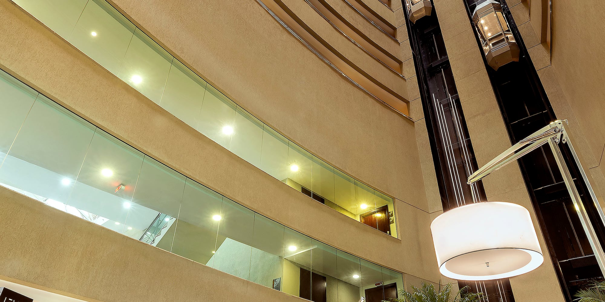 a tall building with a tall ceiling and a tall elevator