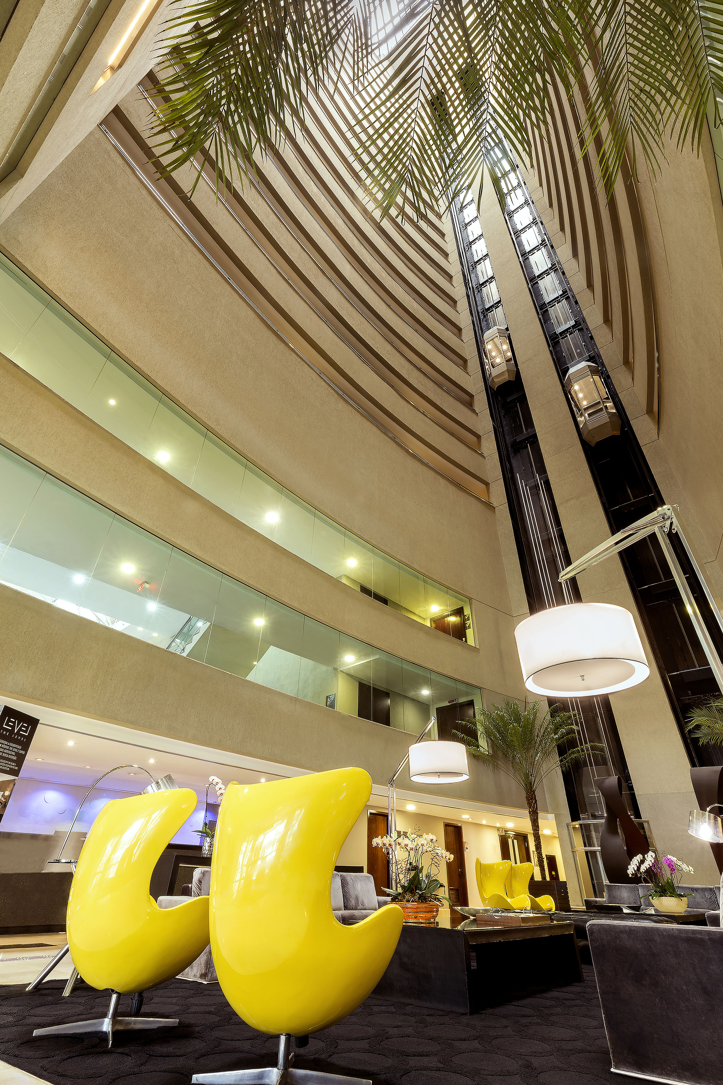a tall building with a tall ceiling and a tall elevator