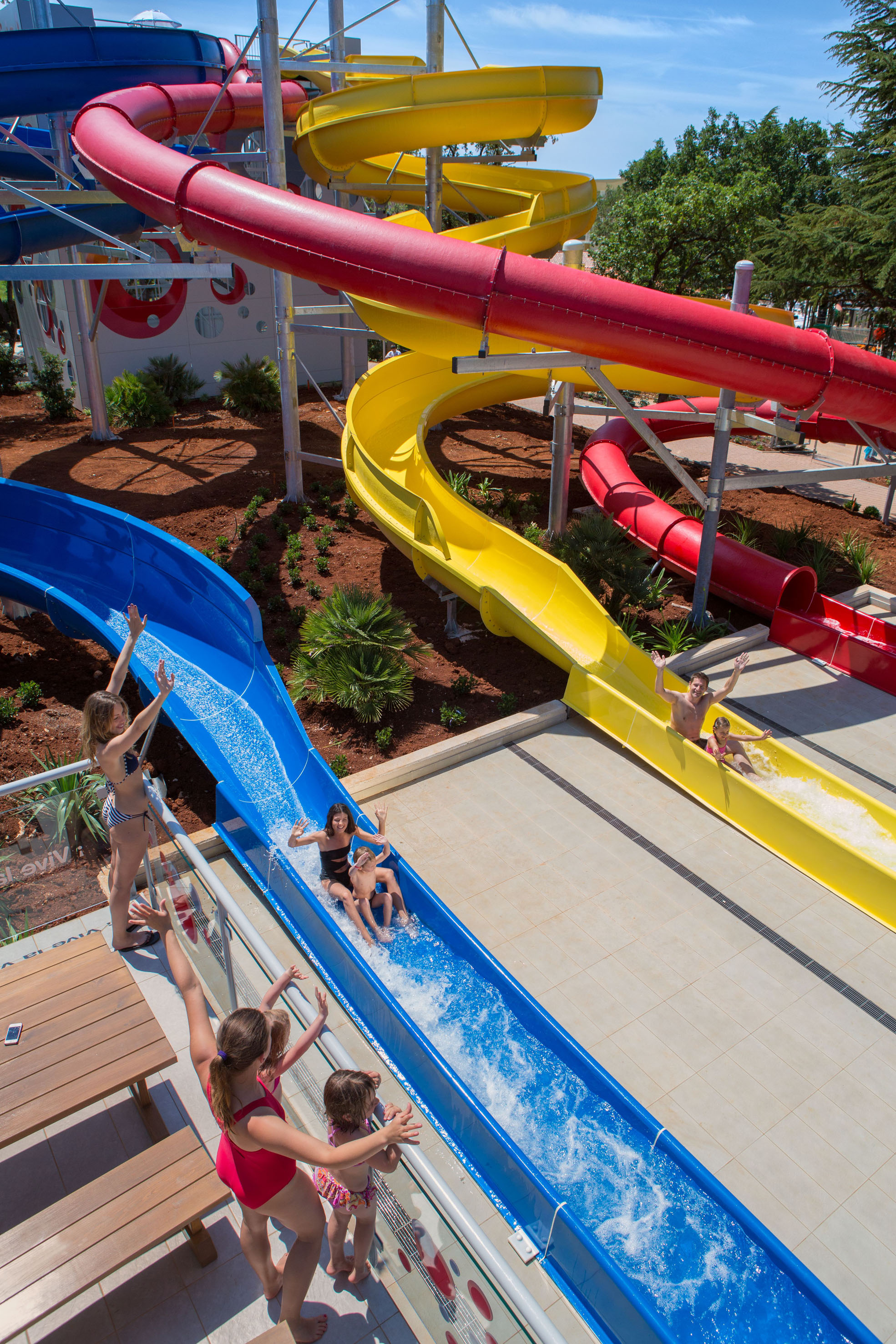 a group of kids on a water slide