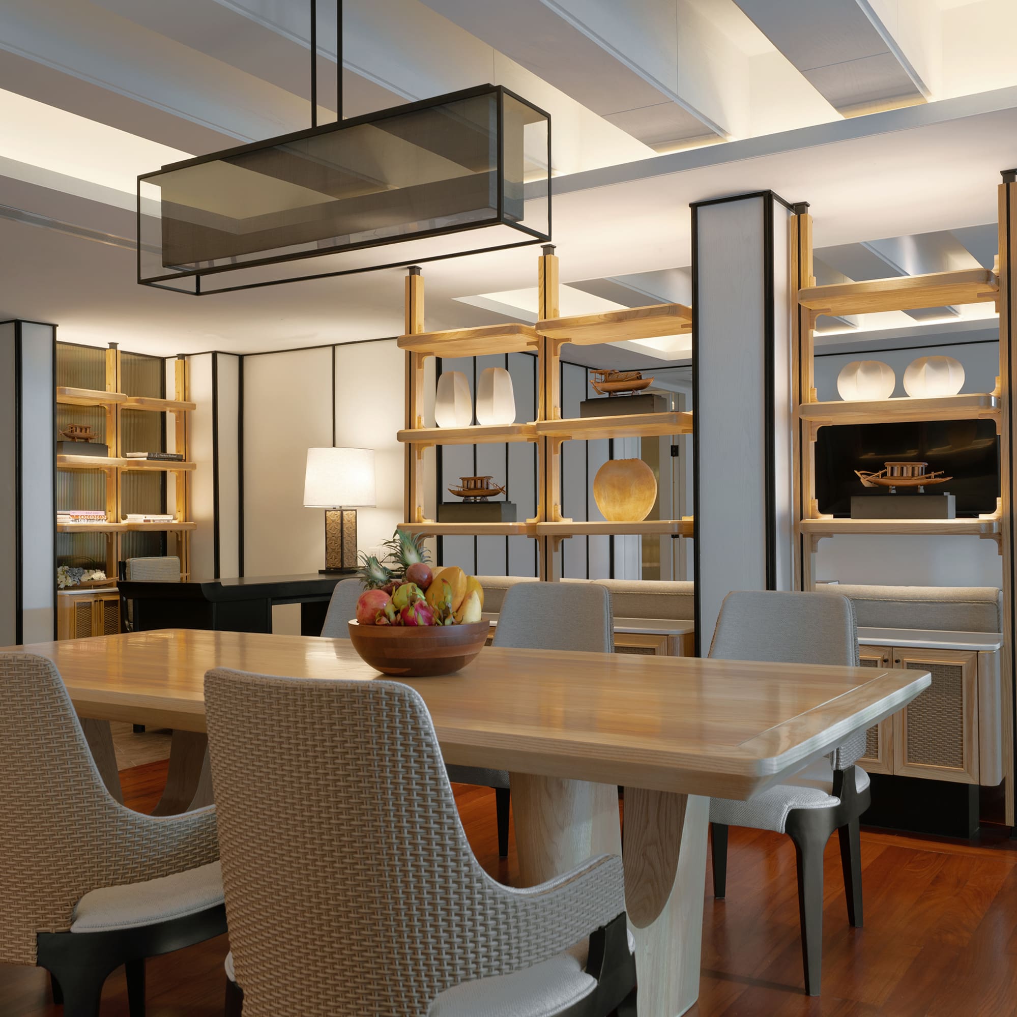 a dining room with a table and chairs