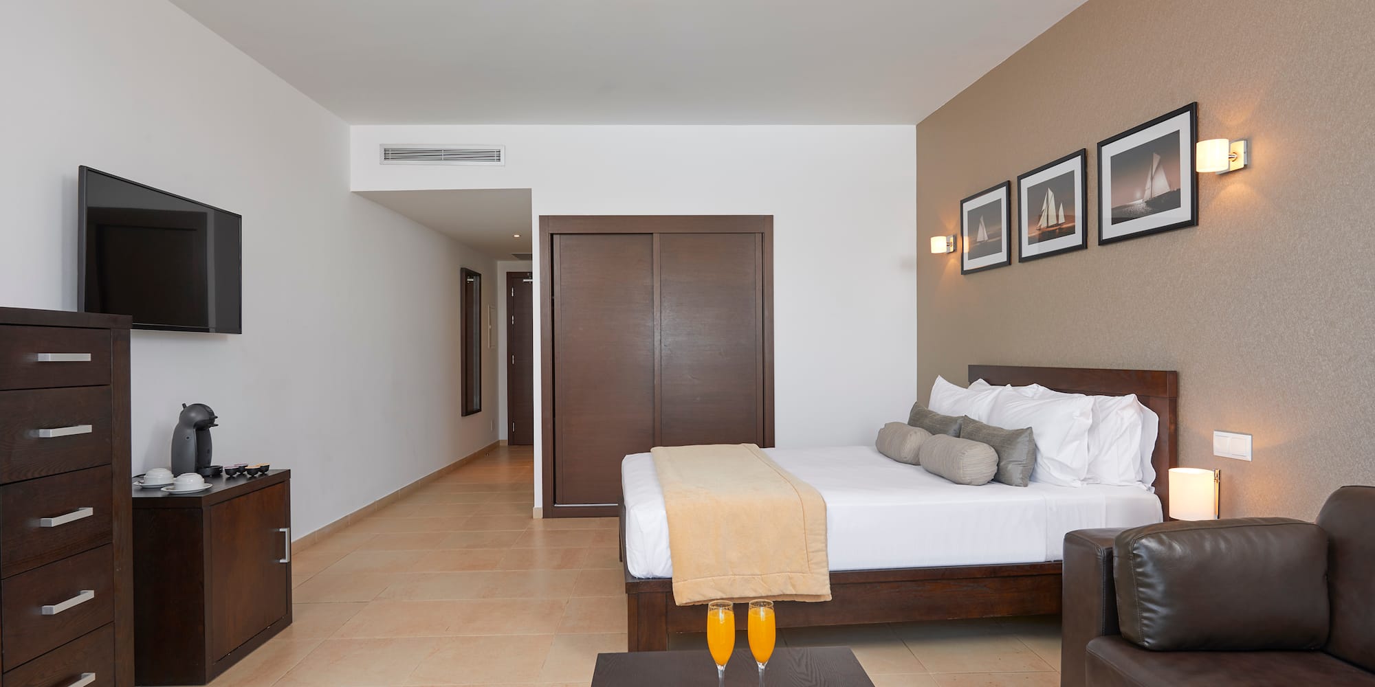 a room with a bed and a coffee table