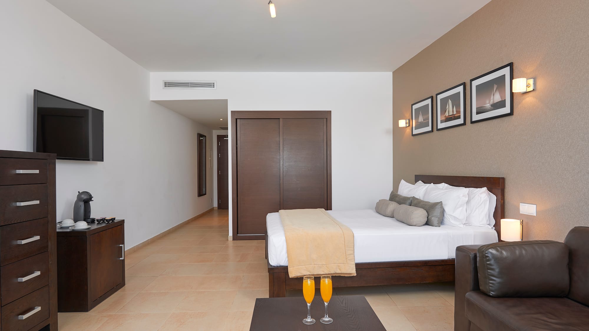 a room with a bed and a coffee table