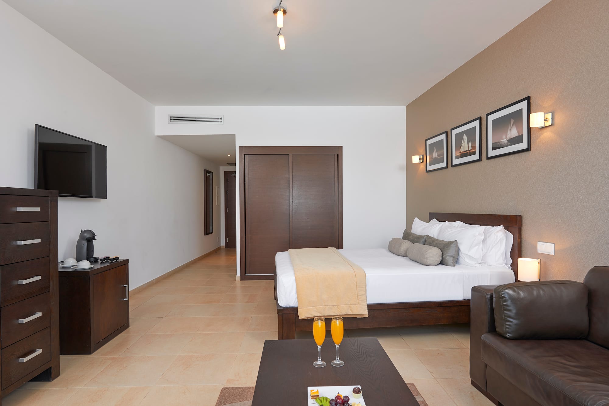 a room with a bed and a coffee table