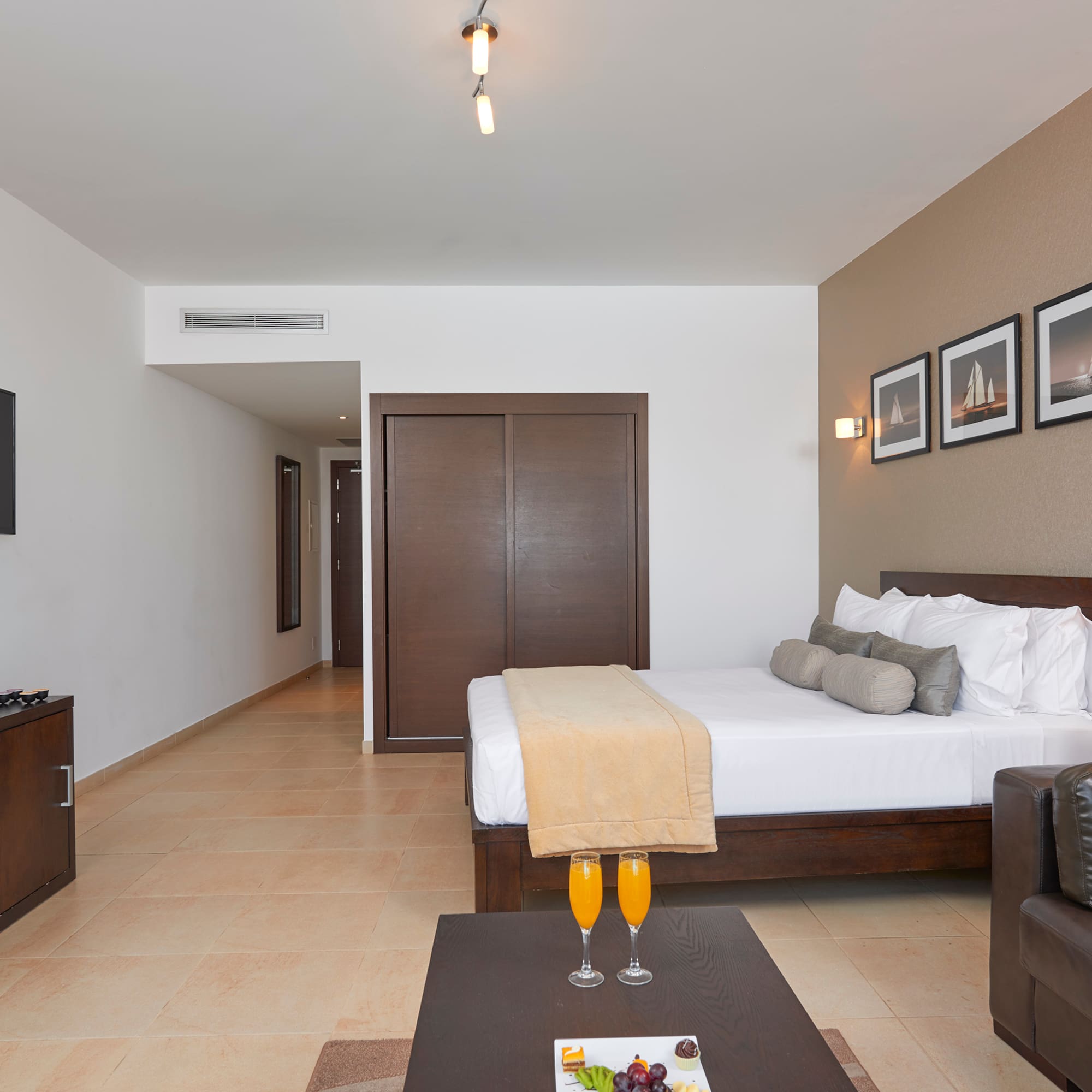 a room with a bed and a coffee table