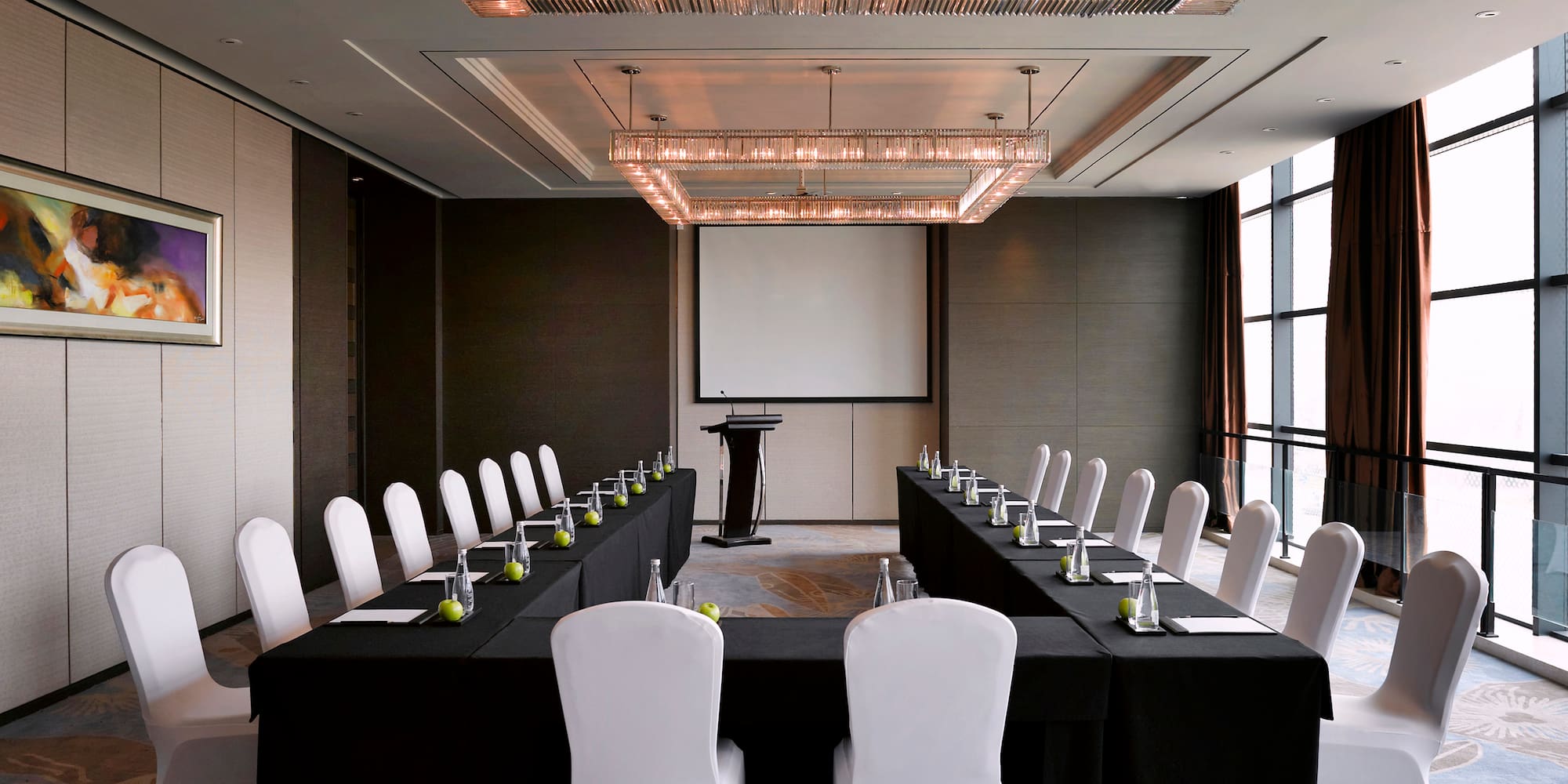 a room with long table and chairs
