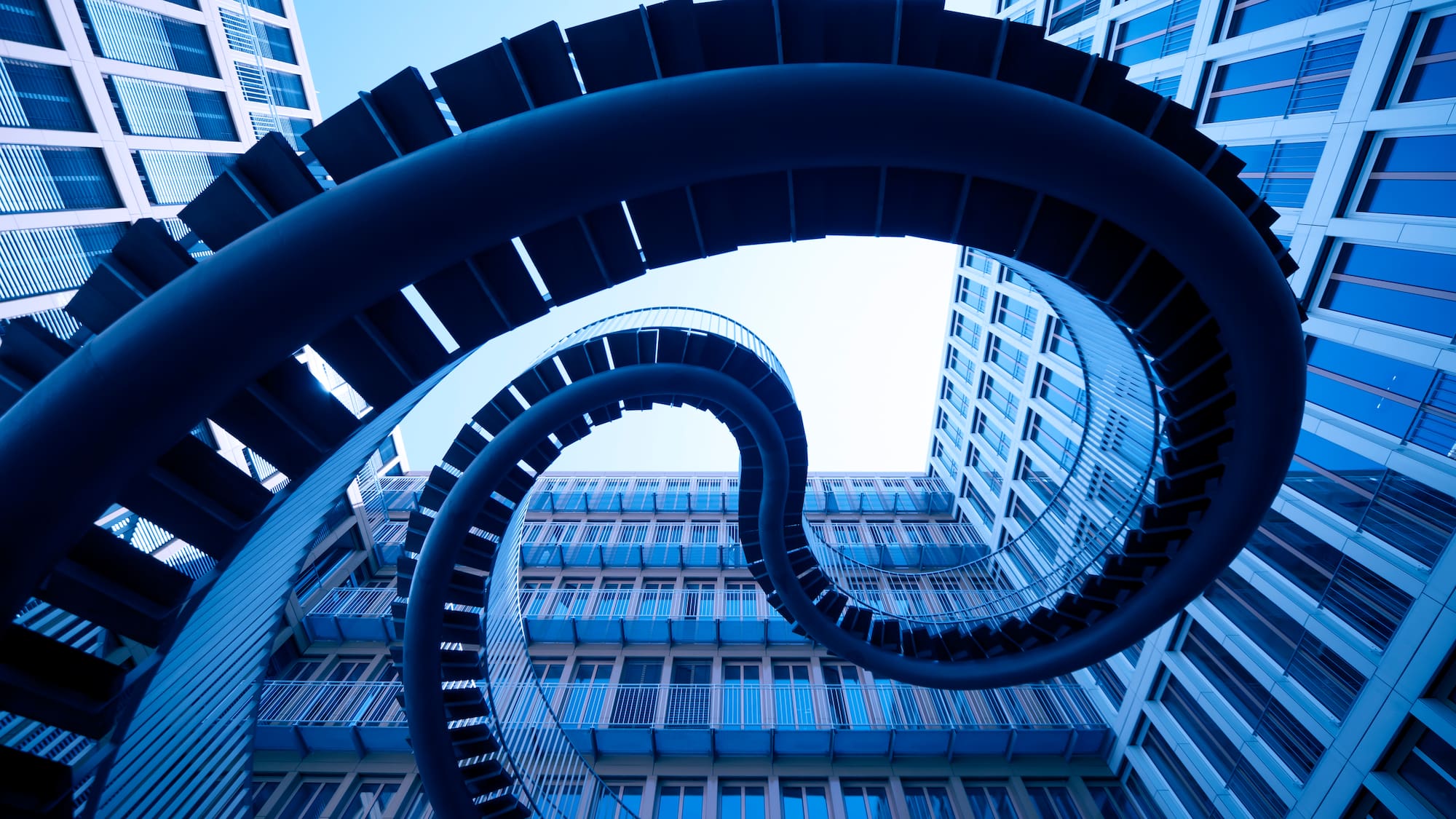 a spiral staircase in front of a building