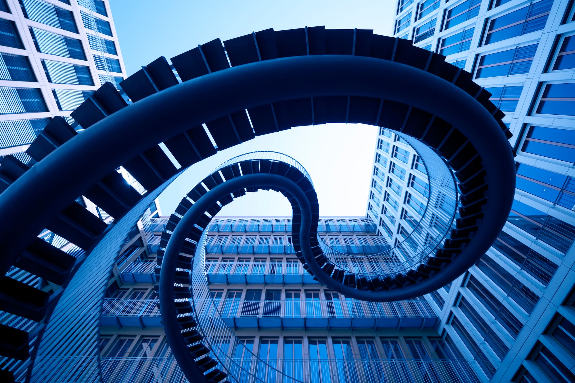a spiral staircase in front of a building