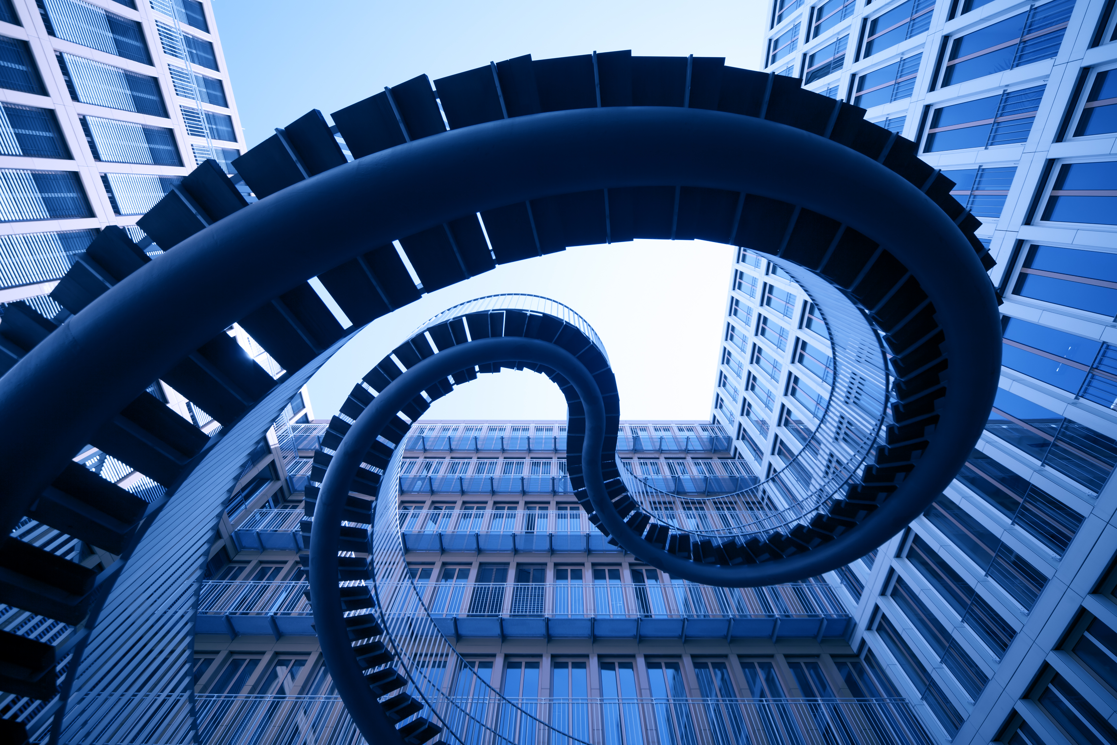 a spiral staircase in front of a building