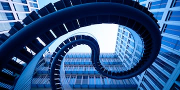 a spiral staircase in front of a building