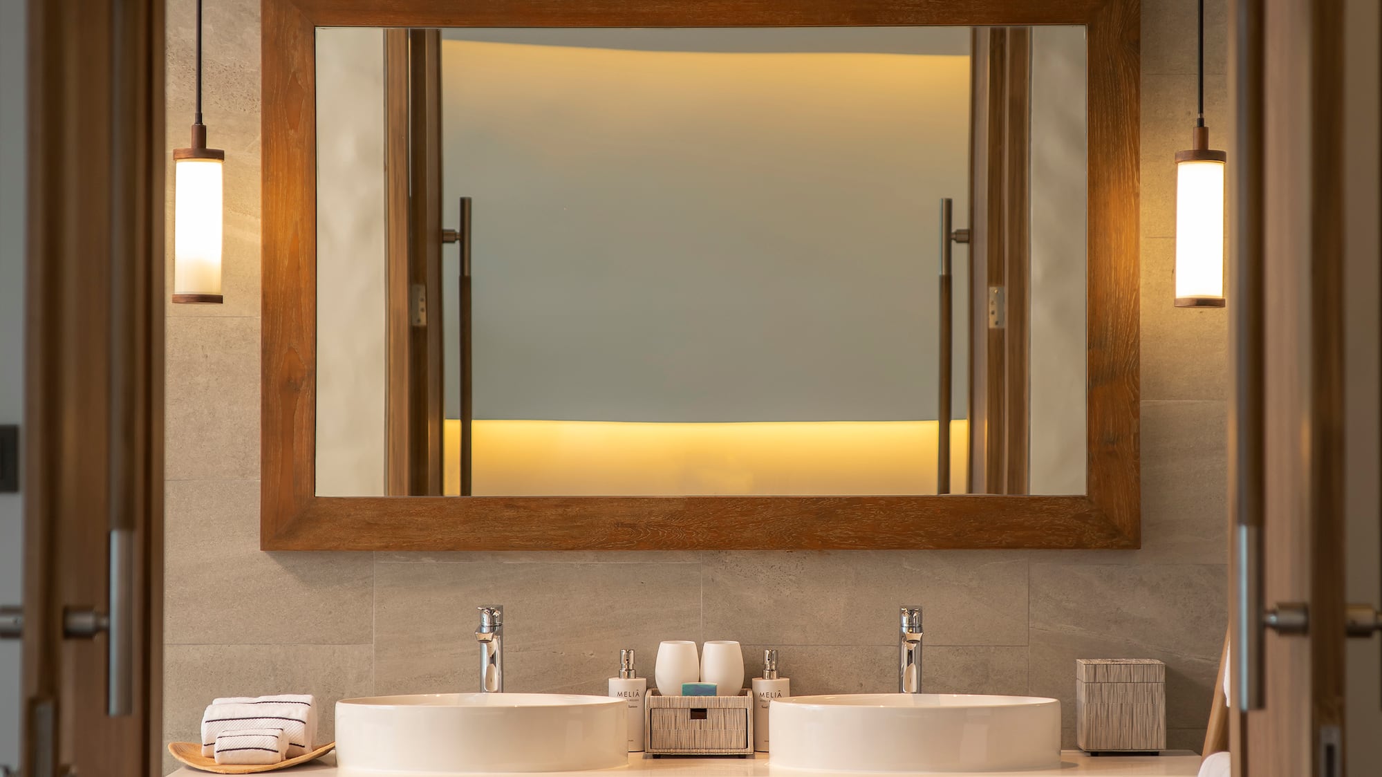 a bathroom with a mirror and sinks