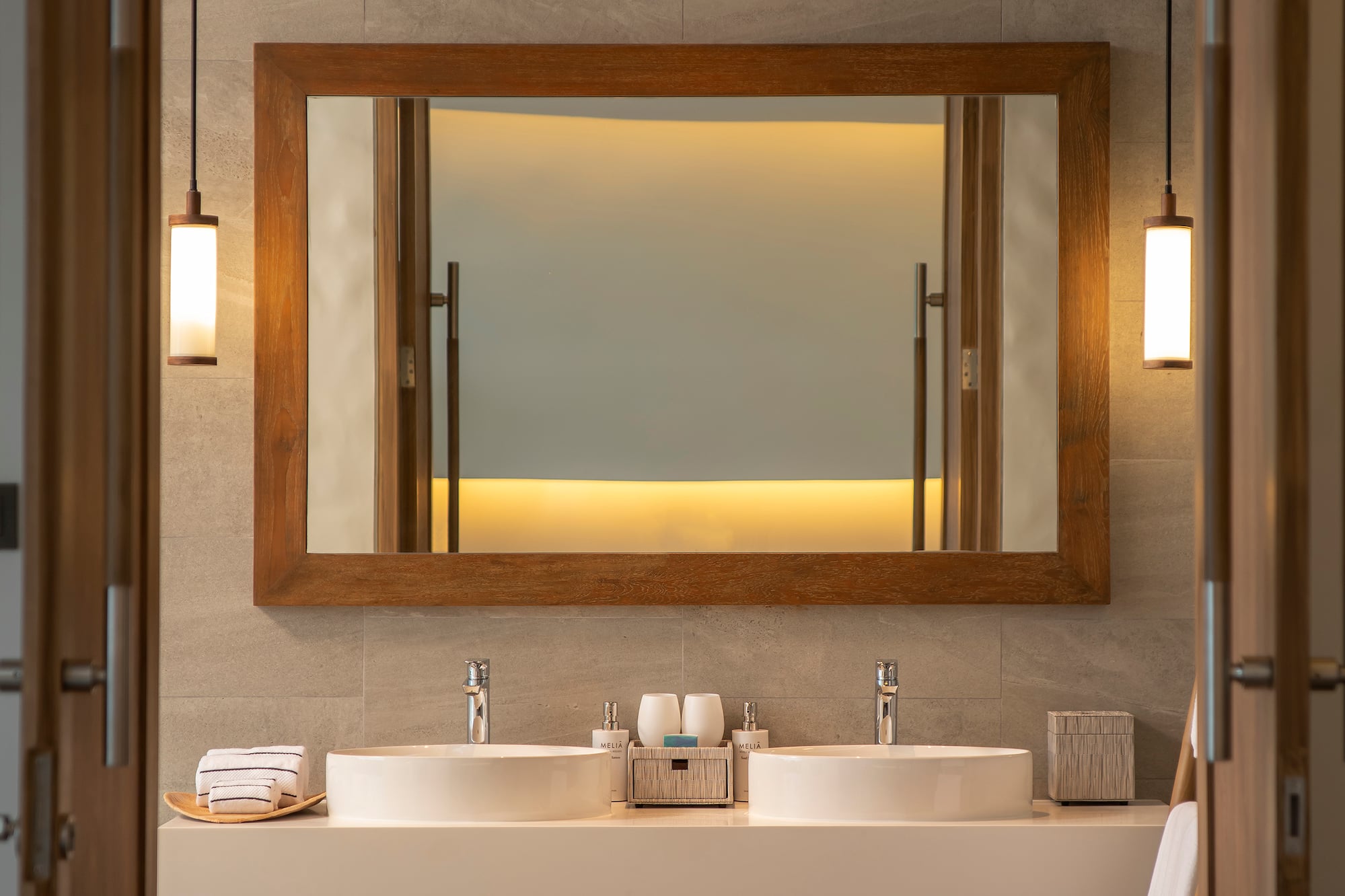 a bathroom with a mirror and sinks