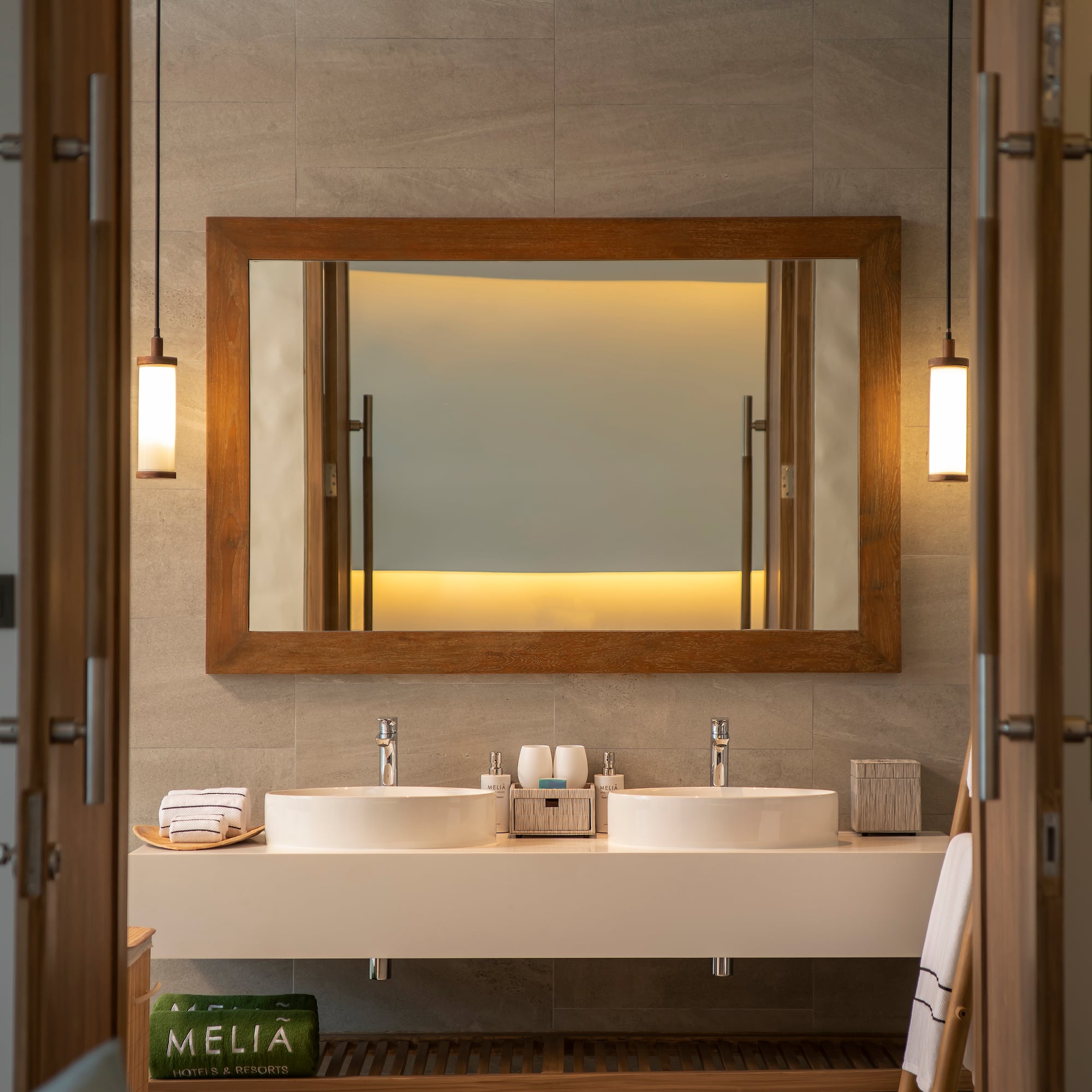 a bathroom with a mirror and sinks