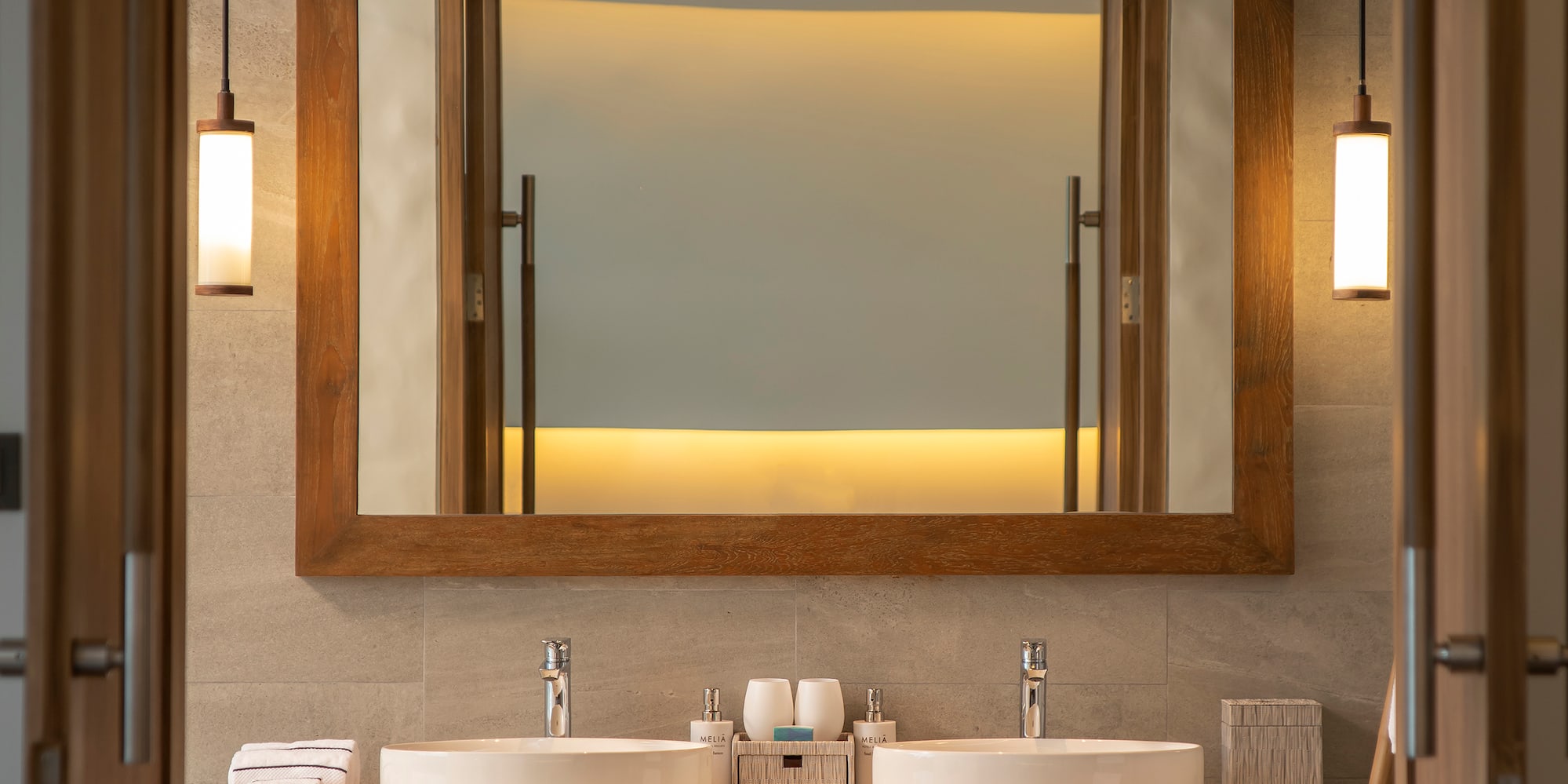 a bathroom with a mirror and sinks