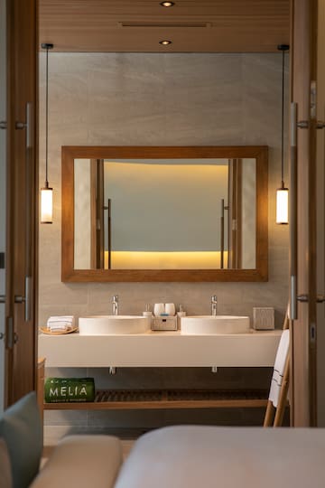 a bathroom with a mirror and sinks