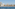 a body of water with buildings and trees