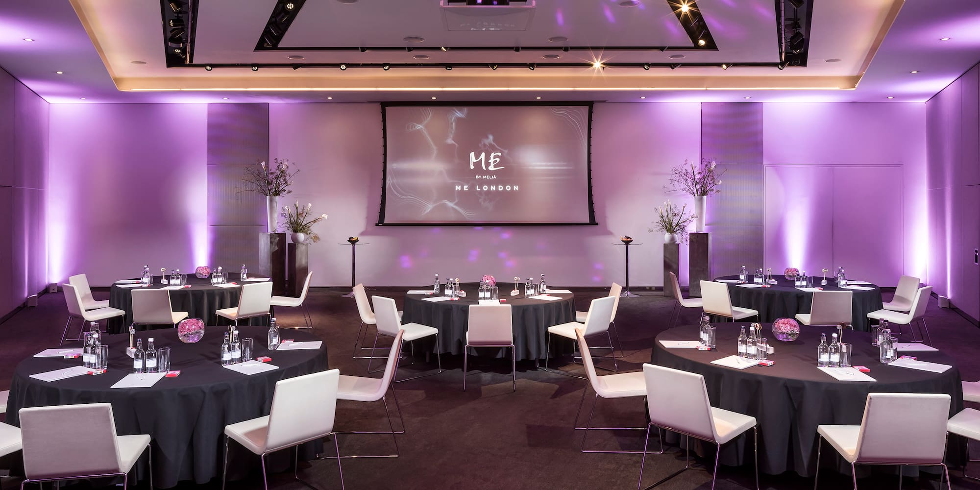 a room with tables and chairs