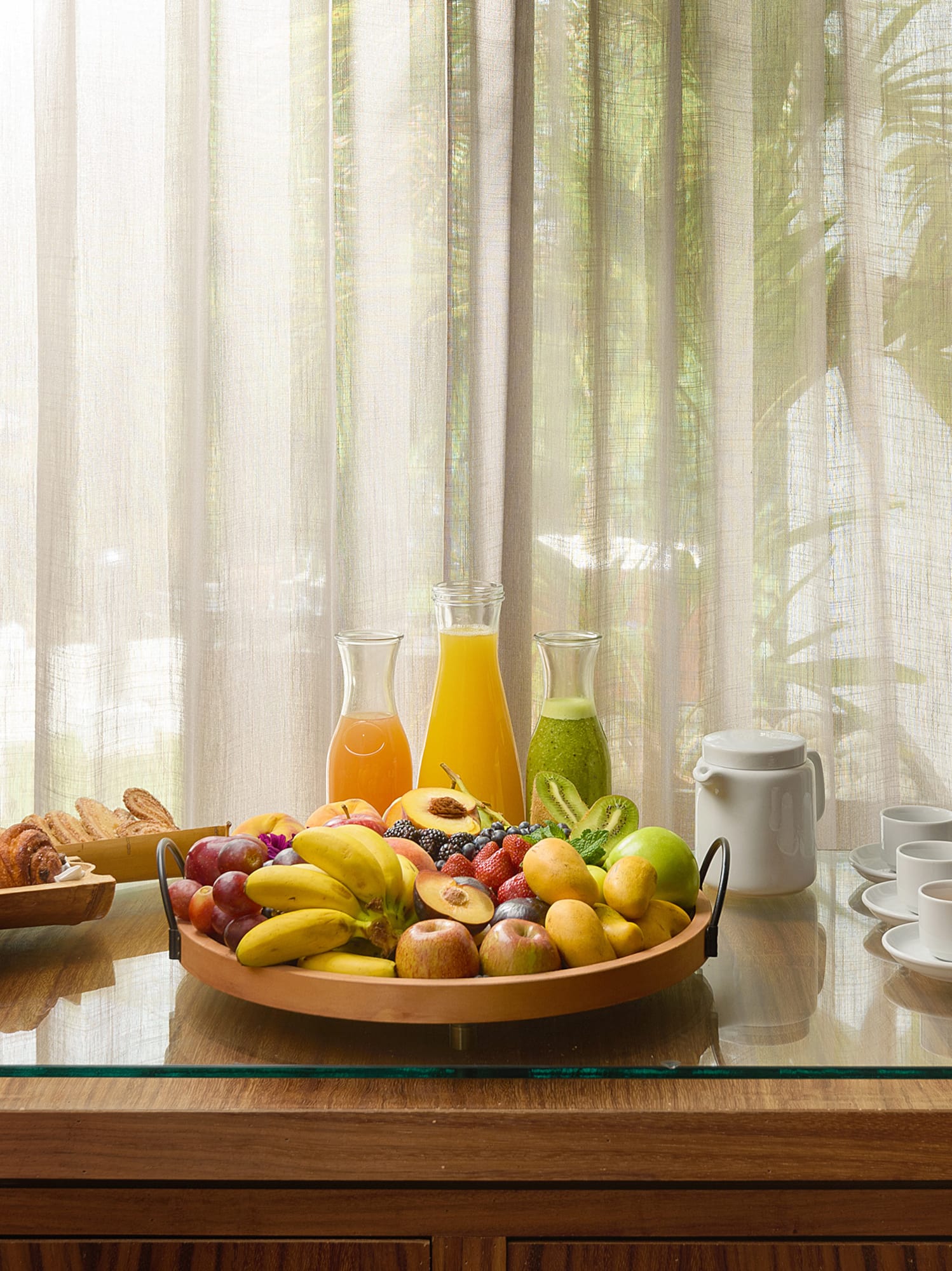 a bowl of fruit on a table