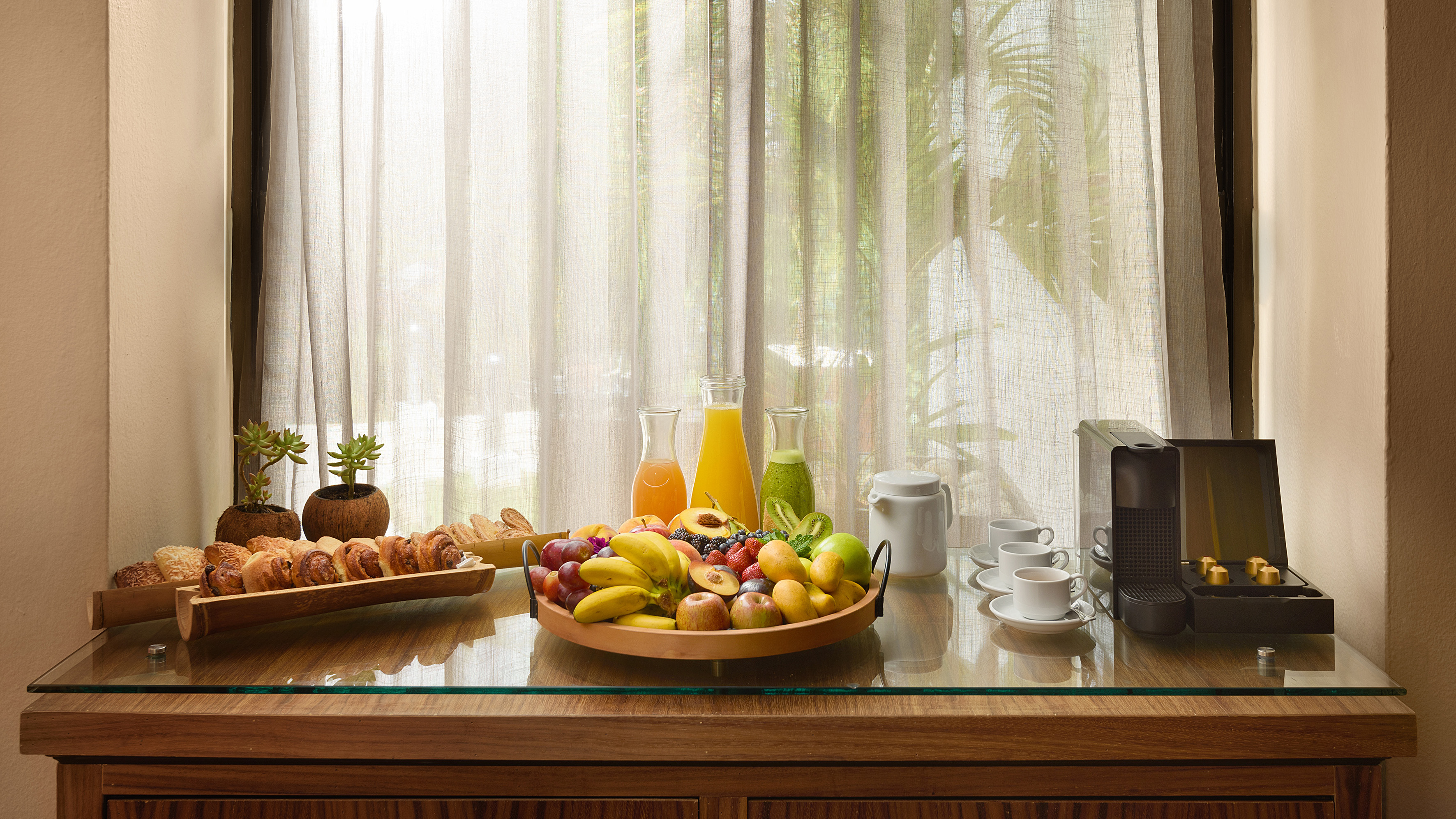 a bowl of fruit on a table