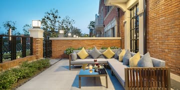 a patio with a couch and a table
